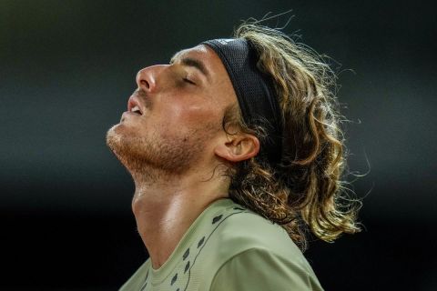 Greece's Stefanos Tsitsipa reacts against Alexander Zverev of Germany during a men's semifinal at the Mutua Madrid Open tennis tournament in Madrid, Spain, Saturday, May 7, 2022. (AP Photo/Manu Fernandez)