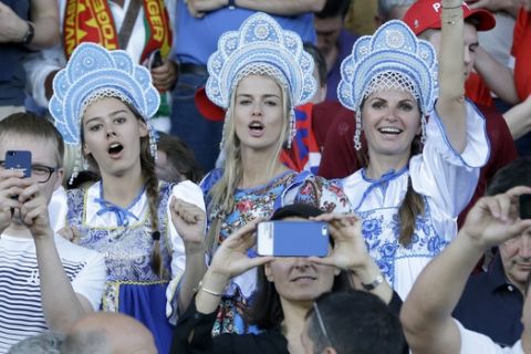 Russian fans wearing traditional outfits cheer from the stands before the Euro 2016 Group B soccer match between Russia and Wales at the Stadium municipal in Toulouse, France, Monday, June 20, 2016. (AP Photo/Thanassis Stavrakis)