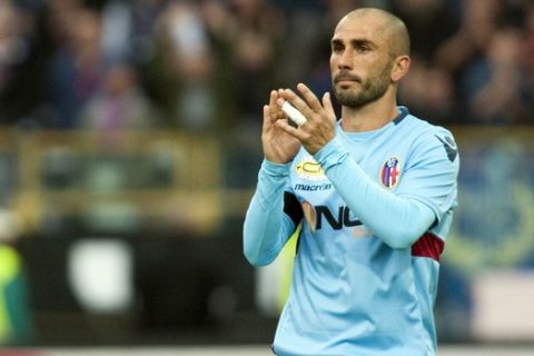 Bologna's Marco Di Vaio applaudes his fans as he played his last game in the Italian championship during their Serie A soccer match at Tardini stadium in Parma, Italy, Sunday, May 13, 2012. (AP Photo/Luigi Vasini)
