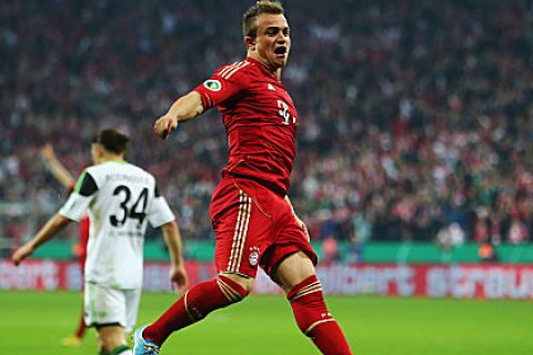 MUNICH, GERMANY - APRIL 16:  Xherdan Shaqiri of Muenchen celebrates his team's third goal during the DFB Cup Semi Final match between Bayern Muenchen and VfL Wolfsburg at Allianz Arena on April 16, 2013 in Munich, Germany.  (Photo by Alex Grimm/Bongarts/Getty Images)