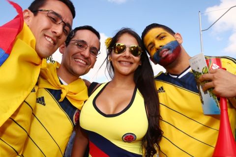 BELO HORIZONTE, BRAZIL - JUNE 14:  A Colombia fan enjoys the atmosphere prior to the 2014 FIFA World Cup Brazil Group C match between Colombia and Greece at Estadio Mineirao on June 14, 2014 in Belo Horizonte, Brazil.  (Photo by Ian Walton/Getty Images)