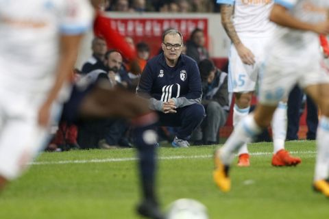 Lille coach Marcelo Bielsa watches the action during their French League one soccer match against Marseille at the Lille Metropole stadium, in Villeneuve d'Ascq, northern France, Sunday, Oct. 29, 2017. (AP Photo/Michel Spingler)