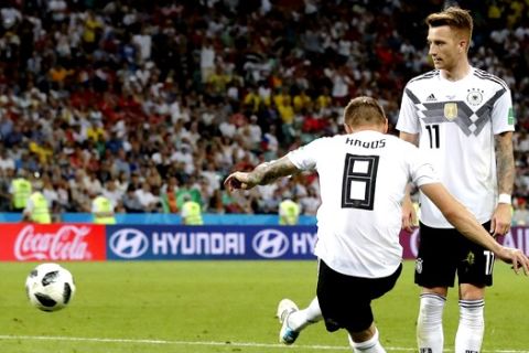 Germany's Toni Kroos, left, scores his side's second goal during the group F match between Germany and Sweden at the 2018 soccer World Cup in the Fisht Stadium in Sochi, Russia, Saturday, June 23, 2018. (AP Photo/Frank Augstein)