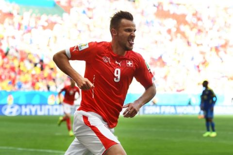BRASILIA, BRAZIL - JUNE 15:  Haris Seferovic of Switzerland celebrates scoring his team's second goal during the 2014 FIFA World Cup Brazil Group E match between Switzerland and Ecuador at Estadio Nacional on June 15, 2014 in Brasilia, Brazil.  (Photo by Stu Forster/Getty Images)