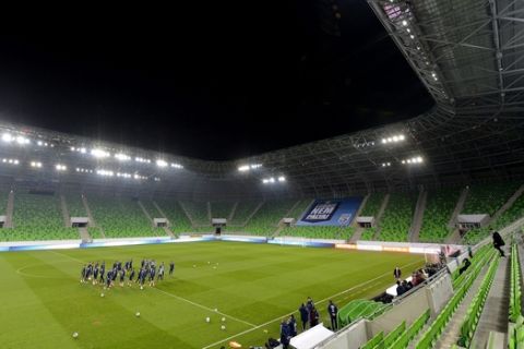 Members of the Russian national soccer team gather on the pitch for a training session in the Groupama Arena in Budapest, Hungary, Monday, Nov. 17, 2014, the eve of the Hungary vs Russia friendly soccer match to be played in the Hungarian capital. (AP Photo/MTI, Tibor Illyes)