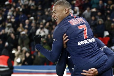 PSG's Kylian Mbappe celebrates after scoring his side's eighth goal during the League One soccer match between Paris Saint Germain and Guingamp at the Parc des Princes stadium in Paris, Saturday, Jan. 19, 2019. (AP Photo/Michel Euler)