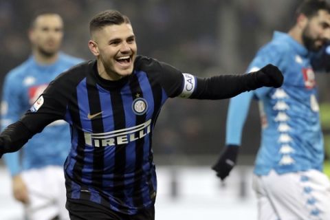 Inter Milan's Mauro Icardi celebrates after his teammate Lautaro Martinez scored during a Serie A soccer match between Inter Milan and Napoli, at the San Siro stadium in Milan, Italy, Wednesday, Dec.26, 2018. (AP Photo/Luca Bruno)