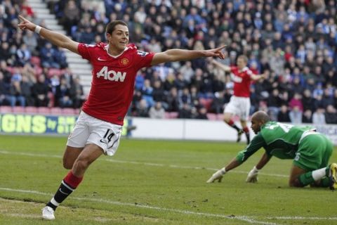 Manchester United's Javier Hernandez celebrates after scoring during their English Premier League soccer match against Wigan Athletic at the DW Stadium in Wigan, northern England, February 26, 2011.  REUTERS/Phil Noble (BRITAIN - Tags: SPORT SOCCER) NO ONLINE/INTERNET USAGE WITHOUT A LICENCE FROM THE FOOTBALL DATA CO LTD. FOR LICENCE ENQUIRIES PLEASE TELEPHONE ++44 (0) 207 864 9000