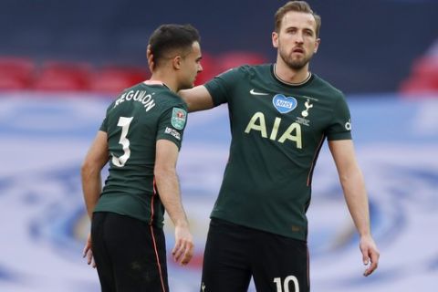 Tottenham's Harry Kane comforts teammate Sergio Reguilon, left, at the end of the English League Cup final soccer match between Manchester City and Tottenham Hotspur at Wembley stadium in London, Sunday, April 25, 2021. Manchester City won 1-0. (AP Photo/Alastair Grant)
