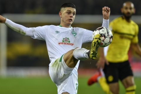 Bremen's Milot Rashica jumps for the ball during the German soccer cup, DFB Pokal, match between Borussia Dortmund and Werder Bremen in Dortmund, Germany, Tuesday, Feb. 5, 2019. (AP Photo/Martin Meissner)