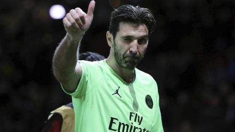 Paris Saint-Germain's Gianluigi Buffon gestures as he leaves the field after the Champions League round of 16 soccer match between Manchester United and Paris Saint Germain at Old Trafford stadium in Manchester, England, Tuesday, Feb. 12, 2019. (Martin Rickett/PA via AP)