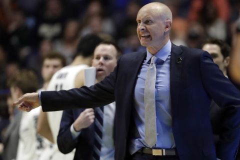 Xavier head coach Chris Mack gestures during the first half of a second-round game against Florida State, in the NCAA college basketball tournament in Nashville, Tenn., Sunday, March 18, 2018. (AP Photo/Mark Humphrey)
