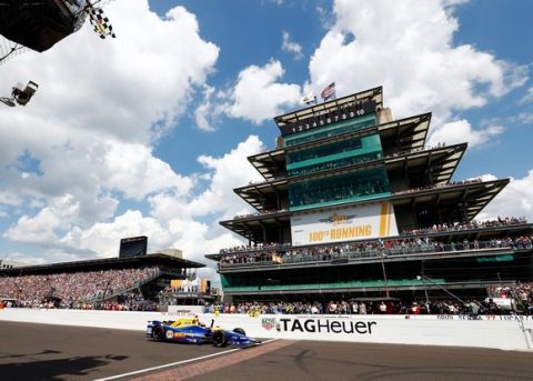 INDIANAPOLIS, IN - MAY 29:  Alexander Rossi of the United States pumps his fist as he takes the checkered flag to win the 100th running of the Indianapolis 500 at Indianapolis Motorspeedway on May 29, 2016 in Indianapolis, Indiana.  (Photo by Jamie Squire/Getty Images)
