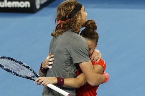 Stefanos Tsitsipas and Maria Sakkari of Greece celebrate winning their mixed doubles match against Switzerland's Roger Federer and Belinda Bencic at the Hopman Cup in Perth, Australia, Thursday Jan. 3, 2019. (AP Photo/Trevor Collens)