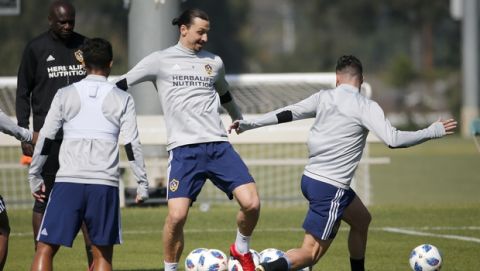 LA Galaxy's newest player Zlatan Ibrahimovic, second right, of Sweden, in actions during an MLS soccer training session at the StubHub Center, Friday, March 30, 2018, in Carson, Calif. (AP Photo/Ringo H.W. Chiu)