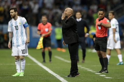 Argentina coach Jorge Sampaoli, center, gives instructions to his players during the group D match between Argentina and Croatia at the 2018 soccer World Cup in Nizhny Novgorod Stadium in Nizhny Novgorod, Russia, Thursday, June 21, 2018. (AP Photo/Petr David Josek)