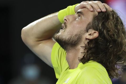 Greece's Stefanos Tsitsipas reacts after defeating Spain's Rafael Nadal in their quarterfinal match at the Australian Open tennis championship in Melbourne, Australia, Wednesday, Feb. 17, 2021.(AP Photo/Hamish Blair)