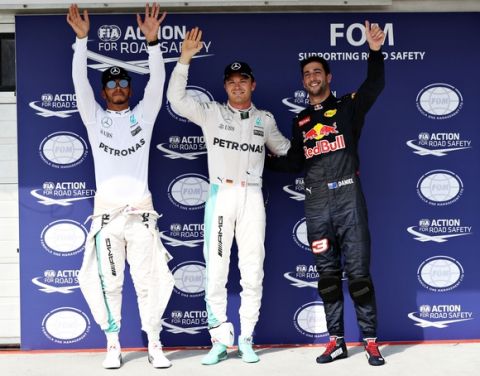 BUDAPEST, HUNGARY - JULY 23:  Top three qualifiers Nico Rosberg of Germany and Mercedes GP, Lewis Hamilton of Great Britain and Mercedes GP and Daniel Ricciardo of Australia and Red Bull Racing wave to the crowd from parc ferme during qualifying for the Formula One Grand Prix of Hungary at Hungaroring on July 23, 2016 in Budapest, Hungary.  (Photo by Mark Thompson/Getty Images)