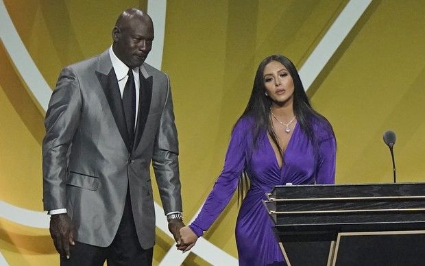 Presenter Michael Jordan, left, holds the hand of Vanessa Bryant, widow of Kobe Bryant, after Kobe Bryant was enshrined with the 2020 Basketball Hall of Fame class Saturday, May 15, 2021, in Uncasville, Conn.