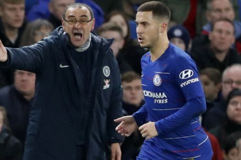 Chelsea's team manager Maurizio Sarri gives instructions to Chelsea's Eden Hazard, right, during the English Premier League soccer match between Chelsea and Leicester City at Stamford Bridge stadium in London, Saturday, Dec. 22, 2018.(AP Photo/Frank Augstein)