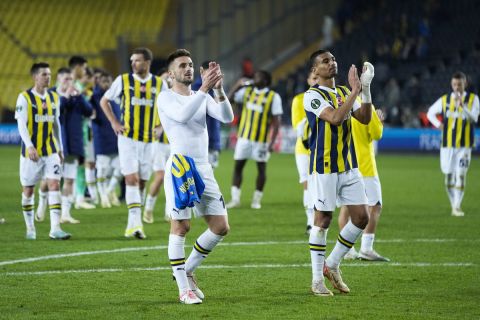 Fenerbahce's players celebrate at the end of the Europa Conference League round of 16 second leg soccer match between Fenerbahce and Union SG at Sukru Saracoglu stadium in Istanbul, Turkey, Thursday, March 14, 2024. (AP Photo/Francisco Seco)