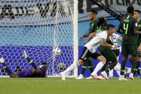 Argentina's Marcos Rojo, scores his side's second goal during the group D match between Argentina and Nigeria, at the 2018 soccer World Cup in the St. Petersburg Stadium in St. Petersburg, Russia, Tuesday, June 26, 2018. Argentina won 2-1. (AP Photo/Petr David Josek)