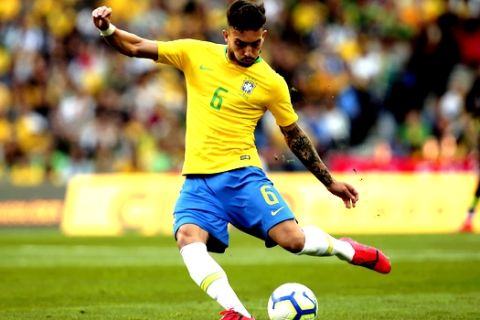 Brazil's Alex Telles kicks the ball during the friendly soccer match between Brazil and Panama at the Dragao stadium in Porto, Portugal, Saturday, March 23, 2019. (AP Photo/Luis Vieira)