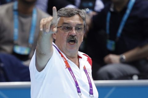 Head Coach of the Croatian men's water polo team Ratko Rudic gestures from the sidelines as his team plays the United States during their men's quarterfinal water polo match at the 2012 Summer Olympics, Wednesday, Aug. 8, 2012, in London. (AP Photo/Alastair Grant)