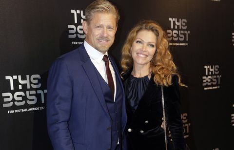 Former danish soccer player Peter Schmeichel and friend arrives at the The Best FIFA 2017 Awards at the Palladium Theatre in London, Monday, Oct. 23, 2017. (AP Photo/Alastair Grant)