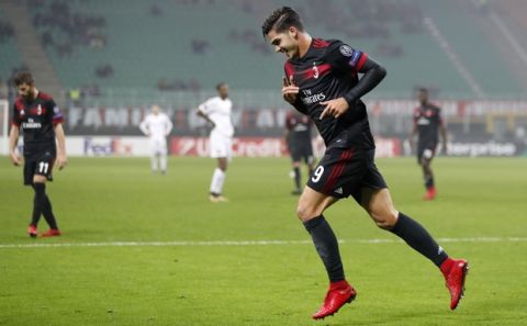 AC Milan's Andre Silva runs after scoring his side's fourth goal during the Europa League group D soccer match between AC Milan and Austria Wien, at the San Siro stadium in Milan, Italy, Thursday, Nov. 23, 2017. (AP Photo/Antonio Calanni)