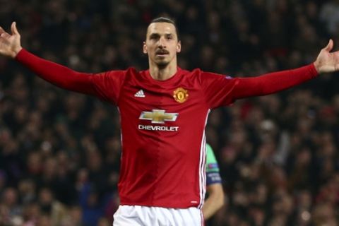 Manchester United's Zlatan Ibrahimovic celebrates after scoring during the Europa League round of 32 first leg soccer match between Manchester United and St.-Etienne at the Old Trafford stadium in Manchester, England, Thursday, Feb. 16, 2017 . (AP Photo/Dave Thompson)