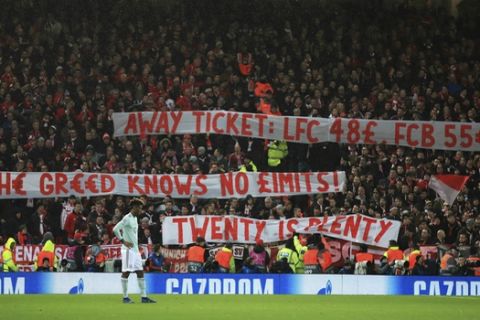 Bayern Munich fans hold up banners in protest against away ticket prices  during the Champions League round of 16 first leg soccer match between Liverpool and Bayern Munich,  at Anfield, in Liverpool, England, Tuesday, Feb. 19, 2019. (Peter Byrne/PA via AP)