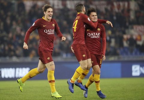 Roma's Cengiz Under, right, celebrates with his teammates after scoring his side's opening goal during the Serie A soccer match between Roma and Inter Milan at the Rome Olympic stadium, Sunday, Dec. 2, 2018. (AP Photo/Andrew Medichini)