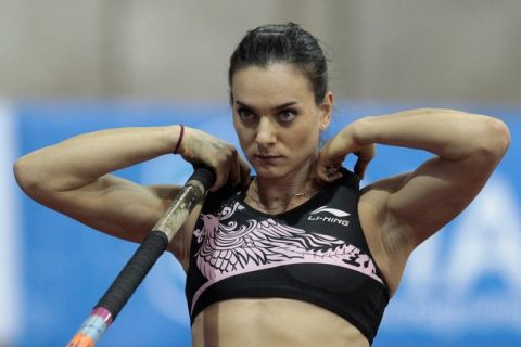Yelena Isinbayeva of Russia prepares for her attempt in the women's pole vault event at the Russian Winter IAAF Indoor Permit Meeting in Moscow, February 6, 2011. REUTERS/Alexander Natruskin (RUSSIA - Tags: SPORT ATHLETICS)