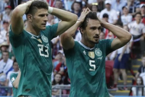 Germany's Mario Gomez, left, and Germany's Mats Hummels, right, hold their heads after failing to score during the group F match between South Korea and Germany, at the 2018 soccer World Cup in the Kazan Arena in Kazan, Russia, Wednesday, June 27, 2018. (AP Photo/Lee Jin-man)