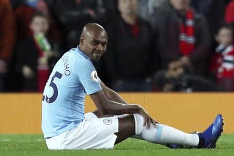Manchester City's Fernandinho sits on the pitch during the English Premier League soccer match between Manchester United and Manchester City at Old Trafford Stadium in Manchester, England, Wednesday April 24, 2019. (AP Photo/Jon Super)