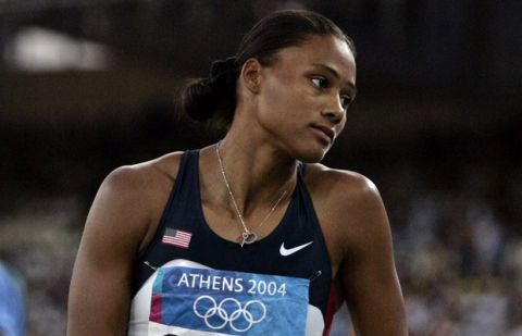 Marion Jones of the United States reacts after jumping in the long jump final at the Olympic Stadium during the 2004 Olympic Games in Athens, Friday Aug. 27, 2004.   (AP Photo/Mark Baker)