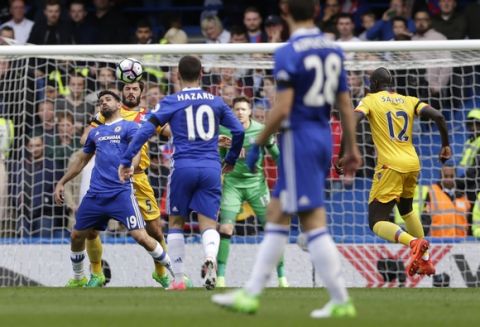 Chelsea's Diego Costa, left is marked by Crystal Palace's James Tomkins as they vie for the ball during the English Premier League soccer match between Chelsea and Crystal Palace at Stamford Bridge stadium in London Saturday, April 1, 2017. (AP Photo/Alastair Grant)