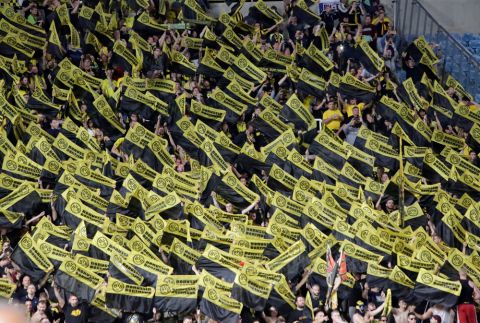 Dortmund fans holds their scarves prior to the Champions League Group H soccer match between APOEL Nicosia and Borussia Dortmund at GSP stadium, in Nicosia, Cyprus, on Tuesday, Oct. 17, 2017. (AP Photo/Petros Karadjias)