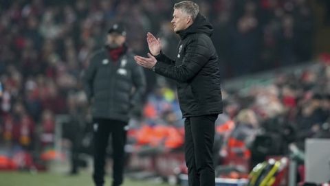 Manchester United's manager Ole Gunnar Solskjaer gestures during the English Premier League soccer match between Liverpool and Manchester United at Anfield Stadium in Liverpool, Sunday, Jan. 19, 2020.(AP Photo/Jon Super)