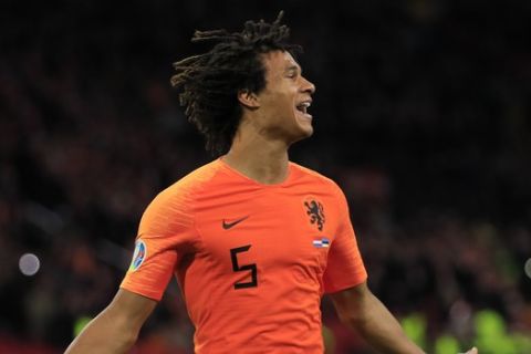 Netherlands' Nathan Ake celebrates scoring his side's second goal during the Euro 2020 group C qualifying soccer match between The Netherlands and Estonia at the Johan Cruyff ArenA in Amsterdam, Netherlands, Tuesday, Nov. 19, 2019. (AP Photo/Peter Dejong)
