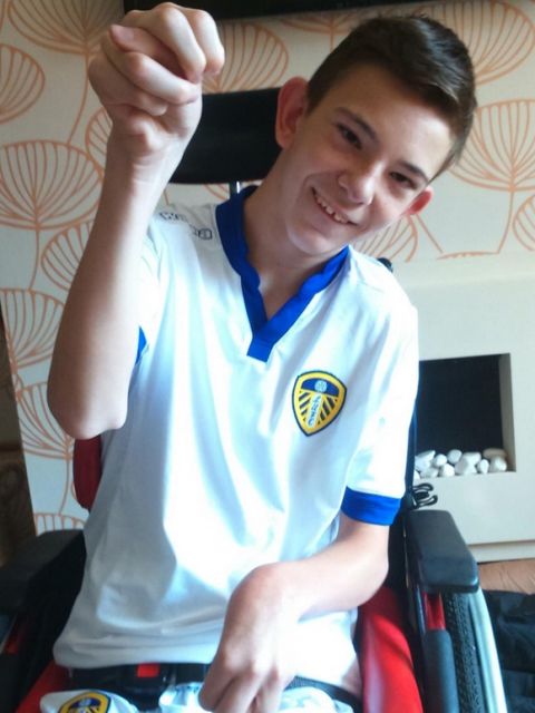 PIC FROM MERCURY PRESS
 (PICTURED - Lewis who is a proud Leeds United fan)
 A furious football fan has hit out at television crews who repeatedly block his disabled son's å£250 view of the pitch - while stewards drove him to tears by filming him and allegedly branding him a 'troublemaker'.
 A photo posted by Leeds United supporter Robin Addy went viral after it showed a Sky Sports cameraman sitting directly in the eyeline of his 14-year-old son Lewis, who has quadriplegic cerebral palsy.
 Robin, 45, claims stewards then filmed the pair after they had complained about the issue and branded them 'troublemakers' during a 2-0 home loss to Blackburn Rovers on Thursday.
 The Elland Road club has now pledged a full investigation, while Sky Sports said has yet to comment.
 SEE MERCURY COP