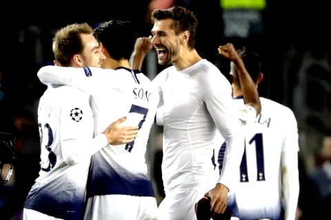 Tottenham midfielder Christian Eriksen, midfielder Son Heung-min and forward Fernando Llorente, from left to right, celebrate at the end of the Champions League group B soccer match between FC Barcelona and Tottenham Hotspur at the Camp Nou stadium in Barcelona, Spain, Tuesday, Dec. 11, 2018. (AP Photo/Emilio Morenatti)