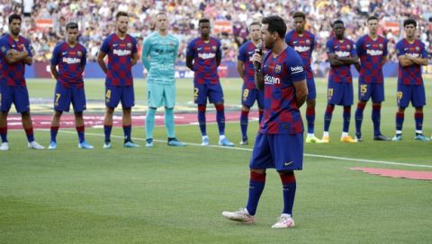 Barcelona forward Lionel Messi addresses to the crowd prior of the Joan Gamper trophy soccer match between FC Barcelona and Arsenal at the Camp Nou stadium in Barcelona, Spain, Sunday, Aug. 4, 2019. (AP Photo/Joan Monfort)