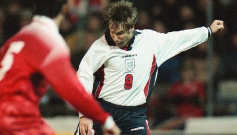 England's Paul Merson, right, scores a goal to even the score 1-1 against Switzerland, while Ramon Vega, left, scorer of the first goal stands near by in a friendly soccer game between Switzerland and England in Bern on Wednesday, March 25, 1998. (AP Photo/Michele Limina)