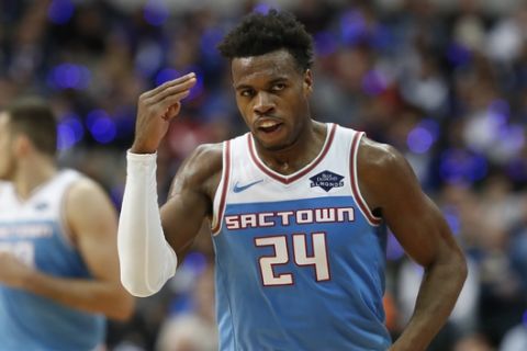 Sacramento Kings guard Buddy Hield (24) salutes after hitting a three pointer during the second half of an NBA basketball game against the Dallas Mavericks in Dallas, Sunday, Dec. 16, 2018. The Kings won 120-113. (AP Photo/LM Otero)