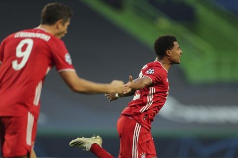 Bayern's Serge Gnabry celebrates after scoring the opening goal of his team during the Champions League semifinal soccer match between Lyon and Bayern Munich at the Jose Alvalade stadium in Lisbon, Portugal, Wednesday, Aug. 19, 2020. (Miguel A. Lopes/Pool via AP)