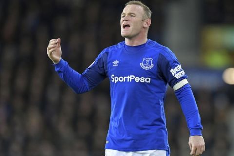 Everton's Wayne Rooney gestures during the English Premier League soccer match between Everton F.C and Huddersfield Town at Goodison Park,Liverpool, England. Saturday. Dec. 2, 2017. (Dave Howarth/PA via AP)