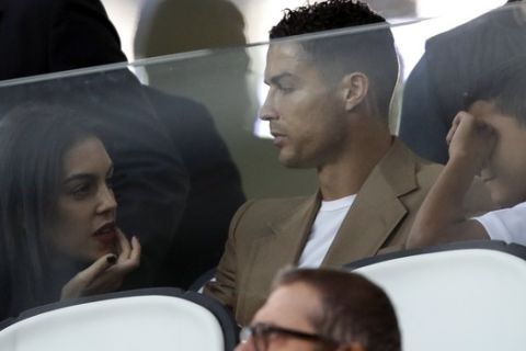 Juventus forward Cristiano Ronaldo and his partner Georgina sit in the stands prior to the Champions League, group H soccer match between Juventus and Young Boys, at the Allianz stadium in Turin, Italy, Tuesday, Oct. 2, 2018. (AP Photo/Luca Bruno)