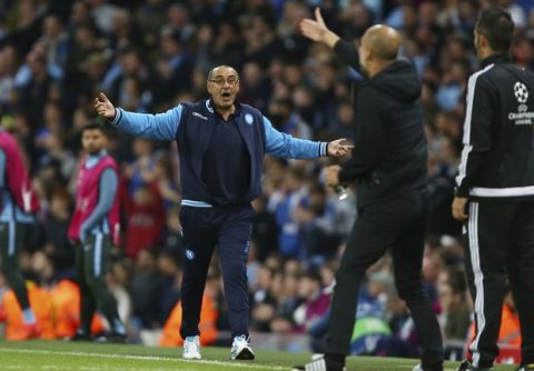 Manchester City coach Josep Guardiola, second from right, gives instructions as Napoli coach Maurizio Sarri, left, gestures during the Champions League group F soccer match between Manchester City and Napoli at the Etihad Stadium in Manchester, England, Tuesday, Oct.17, 2017. (AP Photo/Dave Thompson)